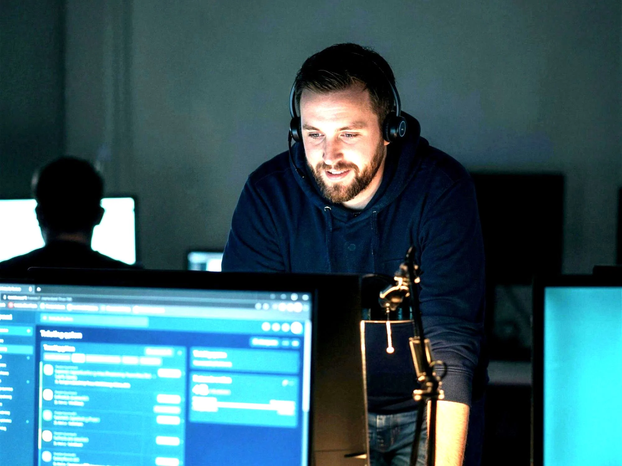 A Supportwave engineer on shift, working a client ticket queue in a headset