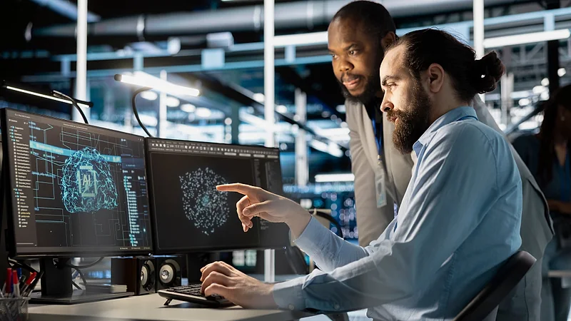 Support engineers reviewing live service dashboards